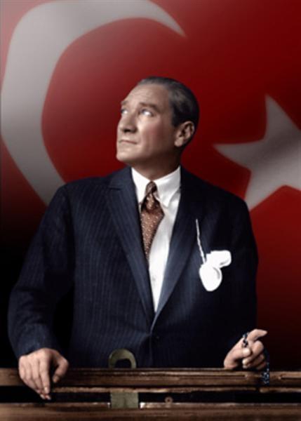 Mustafa_Kemal_Ataturk_looking_through_a_train_window_over_Turkish_flag